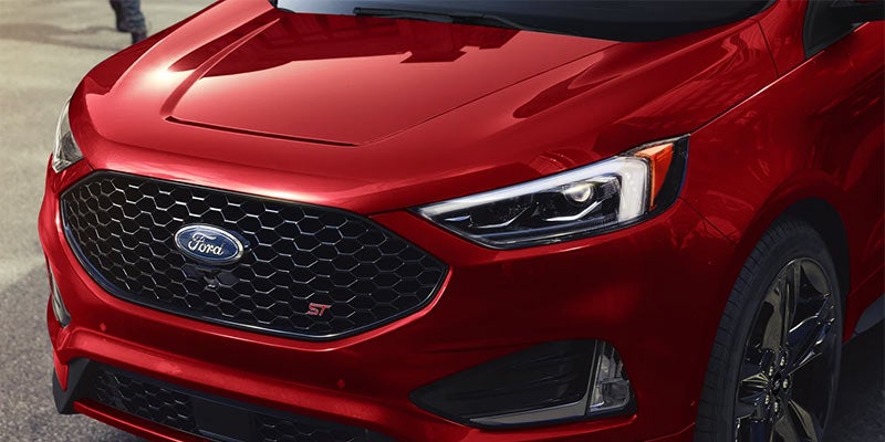 Close view of the front grille area of a red 2022 Ford Edge. | Ford dealer in Jacksonville, AR