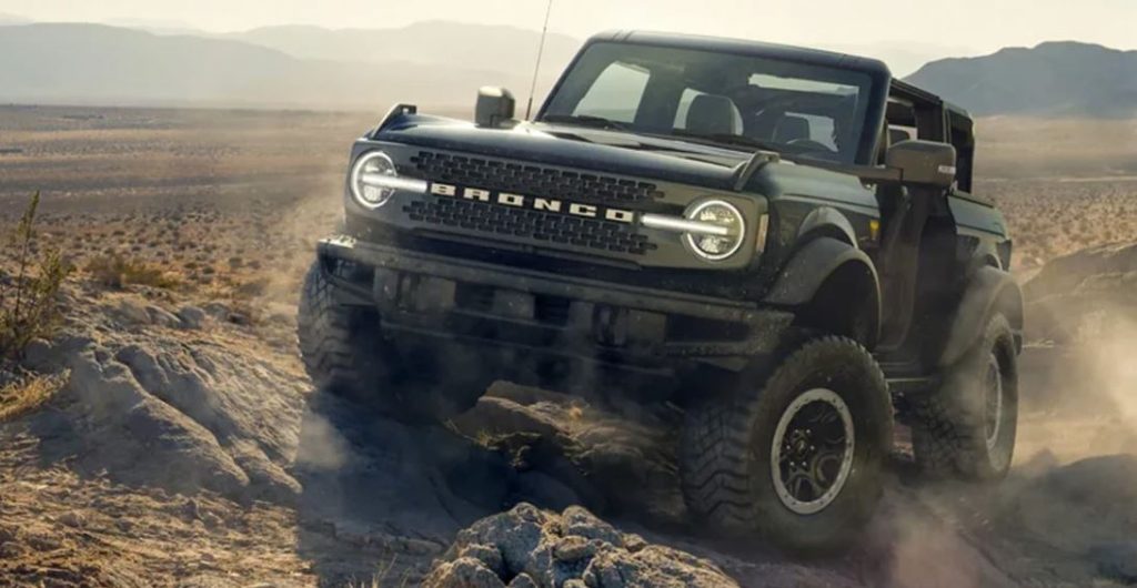 A black 2022 Ford Bronco parked on rocks in a deserted area. | Ford dealer in Jacksonville, AR.