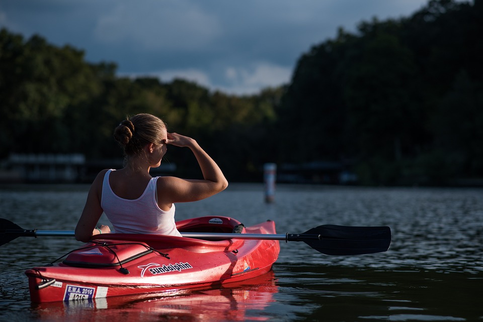 A woman kayaking on a river. | Things to do near Jacksonville, AR. | Ford Dealership 